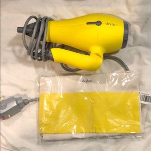 Brand new Drybar travel hair dryer w/ bag.